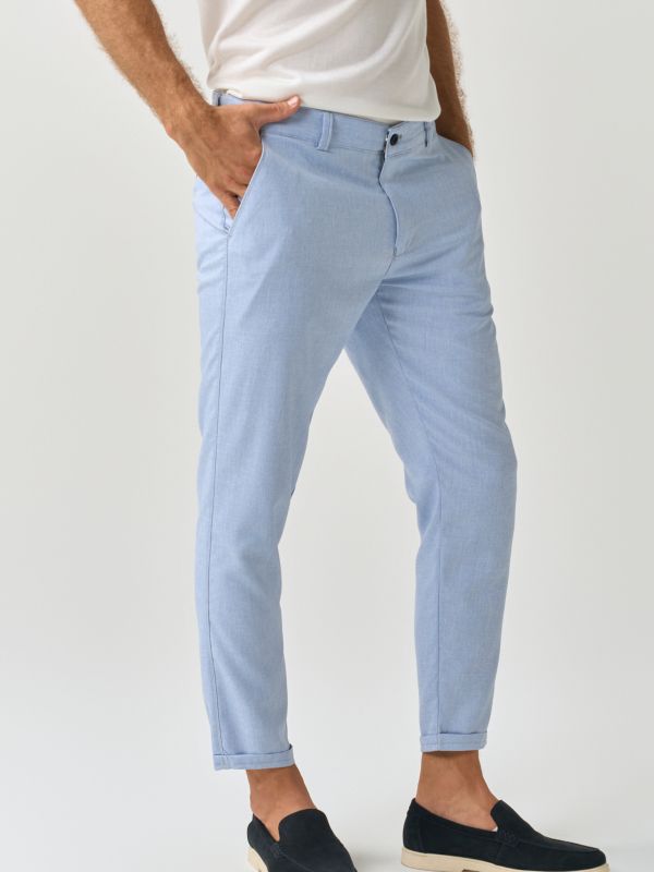 Slim-fit trousers designed for a modern, tailored look in light blue for men, perfect for business and formal occasions from You.Boutique